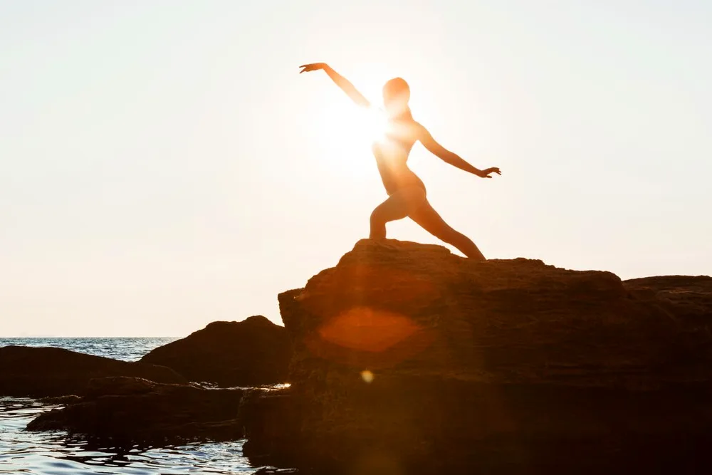 dancing-posing-rock-beach-sea
