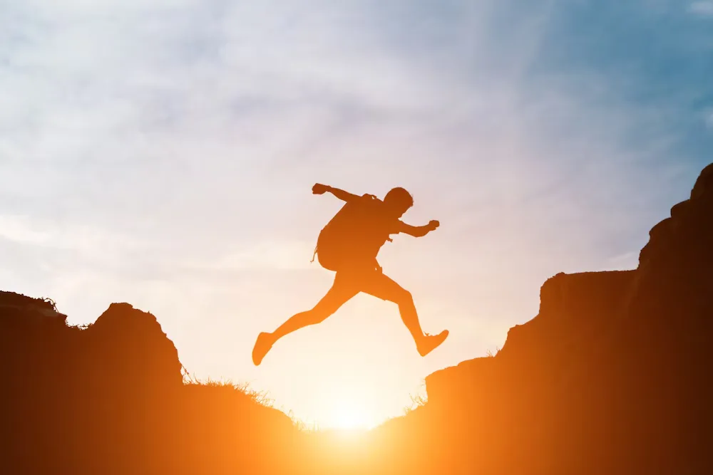 man-jump-through-gaps-hills